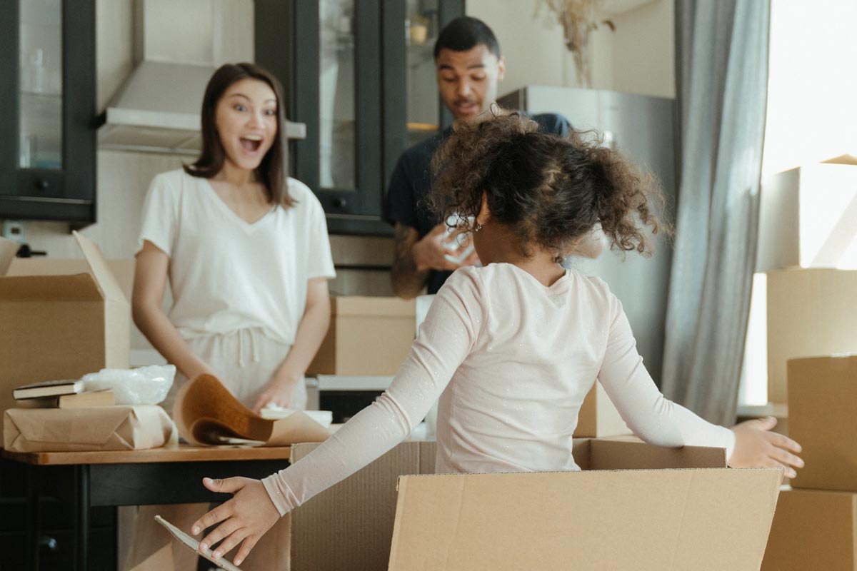 LambertMovingChildren(1200px) Young family packing to move
